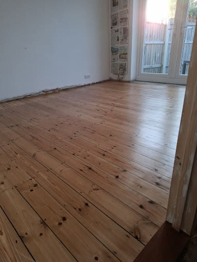 Freshly sanded  and finished floor in Essex, it is gleaming in the sun, all the scratches and damage are gone